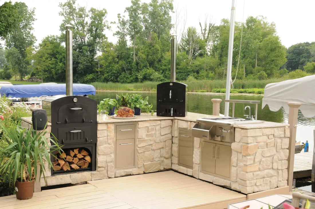 How much does an outdoor pizza oven cost: built-in pizza ovens in a stone outdoor kitchen beside the water