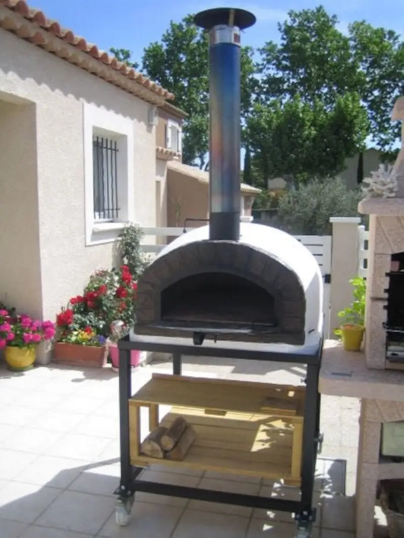 Stainless chimney extension pipe and cap fitted on an Authentic Pizza Ovens brick arch oven on a steel cart