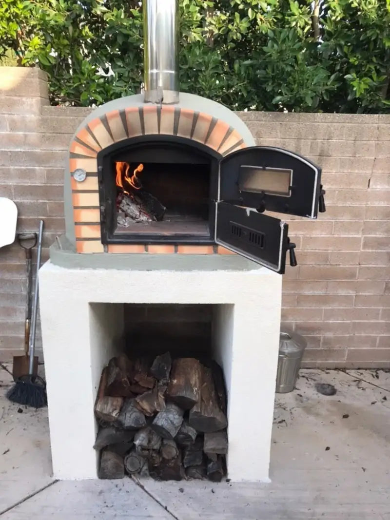 Lisboa Premium on a white masonry base with a wood fire burning and the dutch door open