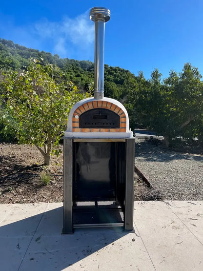 Pizzaioli Premium on a steel stand with the chimney extension and cap fitted