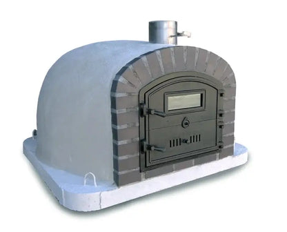 Lume Alto Premium pizza oven from the side showing the white render dome behind the gray cast stone front