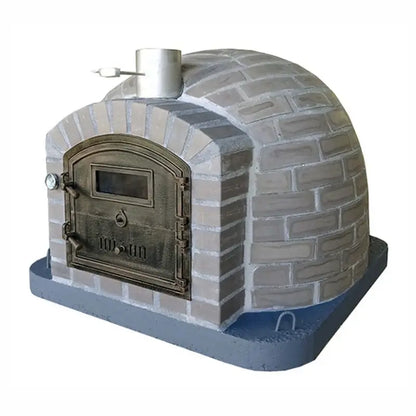 Lume Alto Tudo pizza oven three quarter view showing the cast stone cladding wrapping the whole dome and the stainless chimney spout with damper