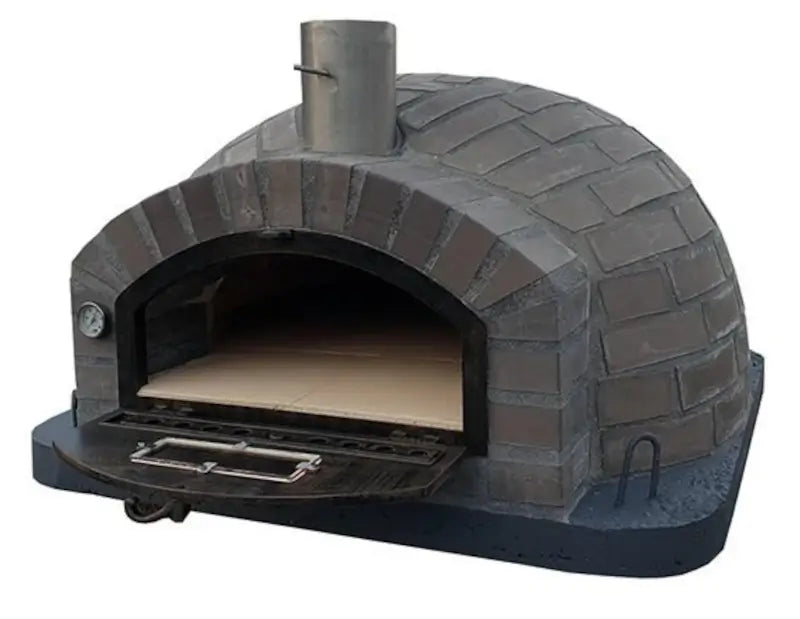Lume Largo Tudo pizza oven three quarter view with the door dropped down, showing the cast stone cladding wrapping the dome and the tiled floor inside