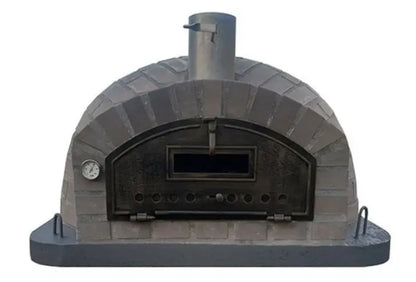 Authentic Pizza Ovens Lume Largo Tudo pizza oven straight on, gray cast stone in a brick pattern over the full low dome with the drop down door latched and the thermometer beside it