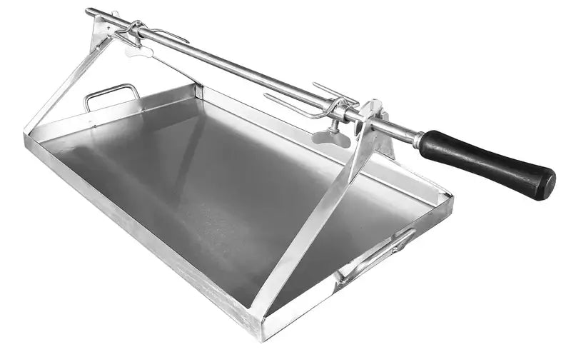Maximus Mobile rotisserie spit from the corner showing the triangular end supports, the drip pan with its carry handles, and the two fork prongs on the rod