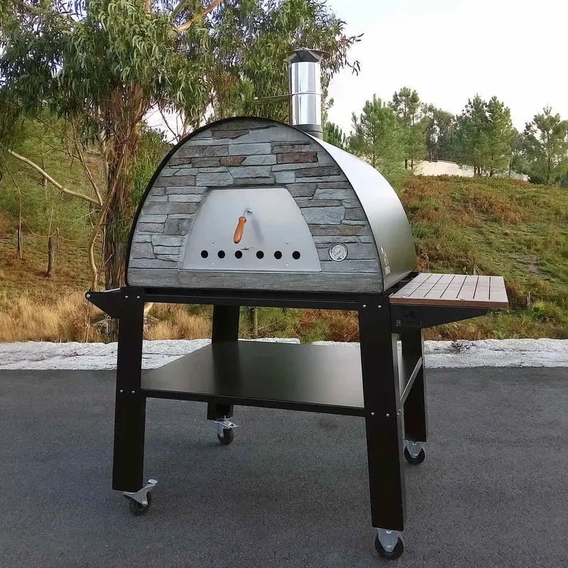 Black Maximus Prime on the Bello stand outdoors with the wood side shelf out, pine hillside behind