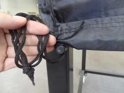 Close up of the drawstring and cord lock toggle on the hem of an Authentic Pizza Ovens oven cover