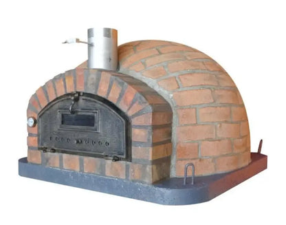 Rustic Pizzaioli three quarter view showing the full tumbled brick dome, cast aluminum door, and chimney spout with damper