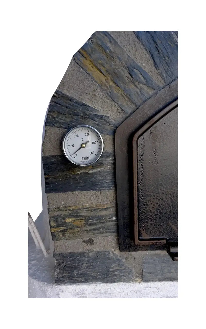 Close up of the 0 to 500°C dial thermometer set into the slate stone arch beside the cast aluminum door of a Pizzaioli Stone Arch