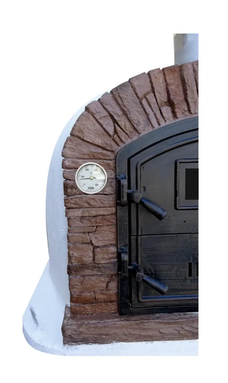 Close up of the dial thermometer and reddish brown stacked stone facade beside the door of a Ventura Sierra pizza oven