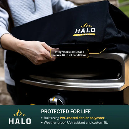 Fitting the Halo Versa 16 Pizza Oven Cover showing the integrated wraparound elastic