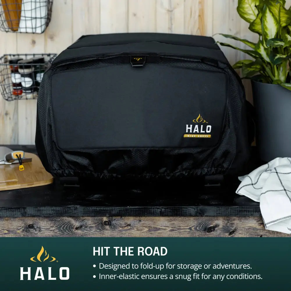 Halo Versa 16 Pizza Oven Cover on the oven outdoors, folds up for storage and travel