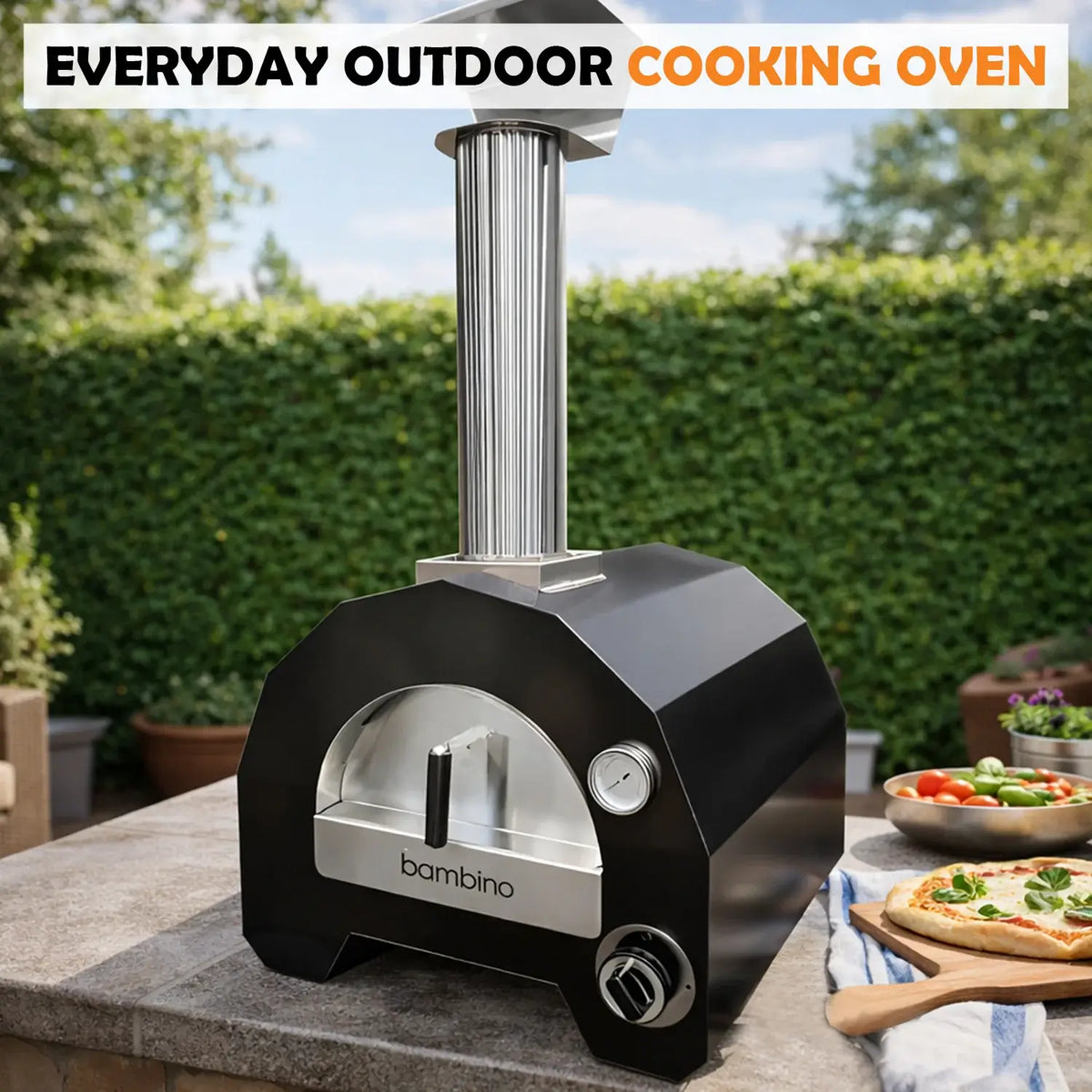 ItaliaForno Bambino compact gas pizza oven on a stone garden wall with a pizza on the peel