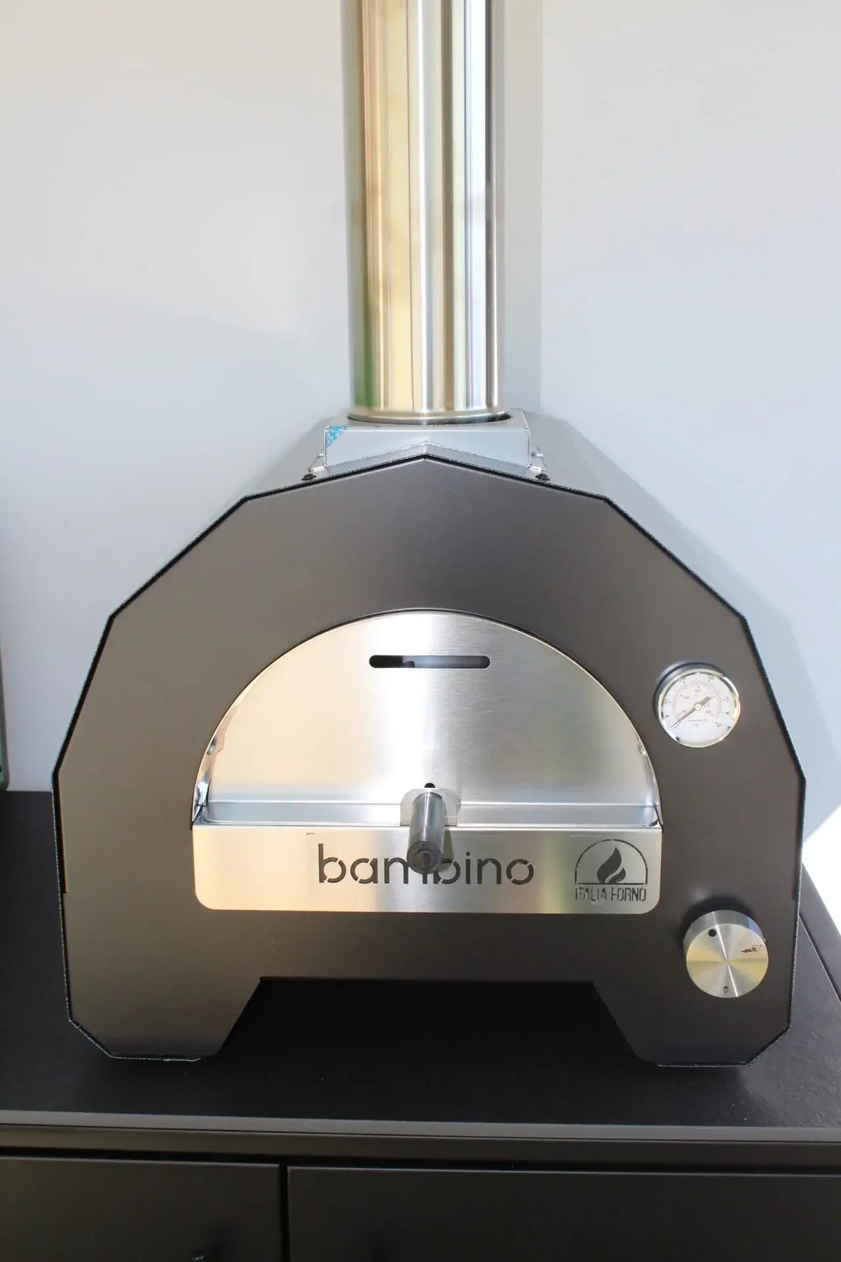 ItaliaForno Bambino compact gas pizza oven, straight on, showing the octagonal dome and stainless front