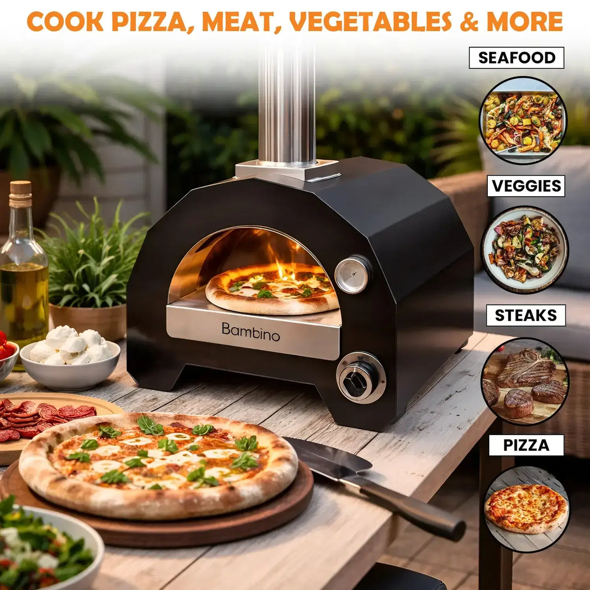 ItaliaForno Bambino on a patio table with a pizza in the oven and steaks, seafood and vegetables ready