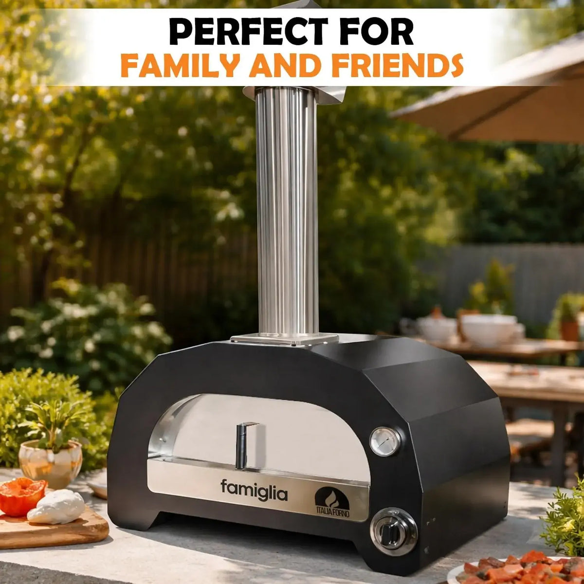 ItaliaForno Famiglia gas pizza oven on a stone patio table with prep ingredients