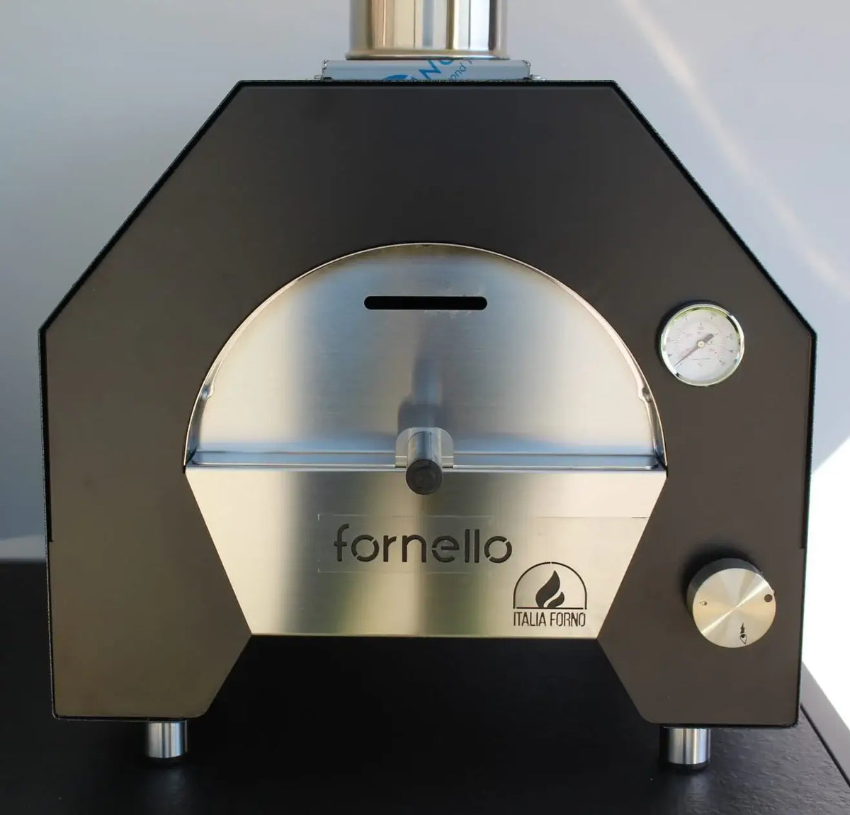ItaliaForno Fornello compact gas pizza oven from the front, showing the five sided dome and stainless door