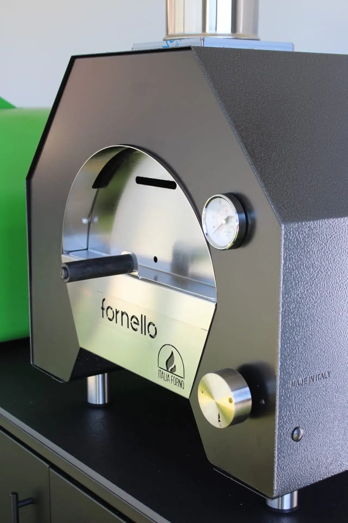 Close up of the ItaliaForno Fornello five sided dome, door and thermometer with Made in Italy stamped on the body