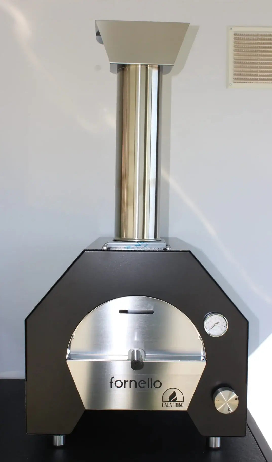 ItaliaForno Fornello compact gas pizza oven, straight on, with the chimney and cap fitted