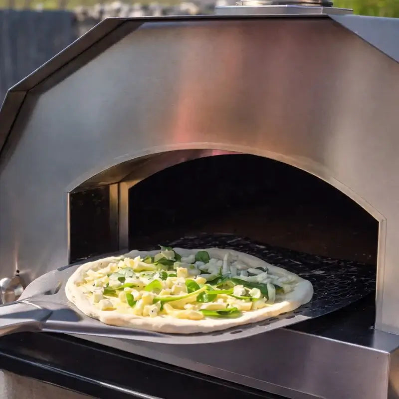 Pizza on the peel going into the ItaliaForno Grande Pro Duo mouth